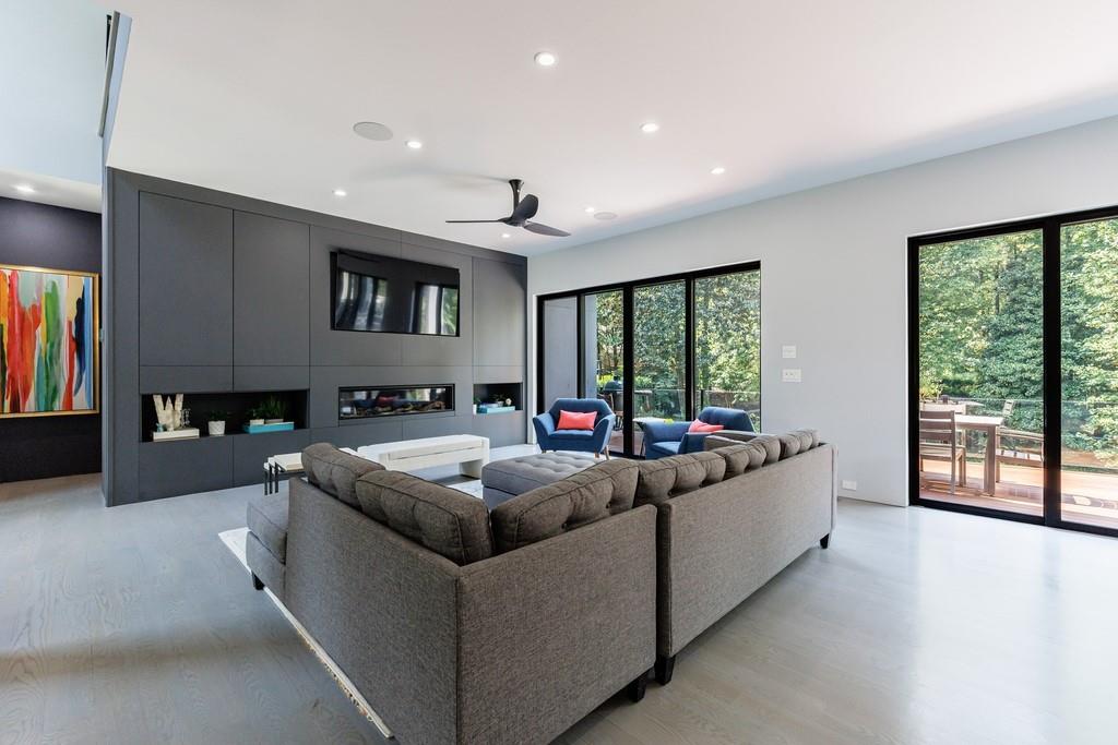 4036 Statewood Road Northeast Atlanta, GA 30342 - Photo 22 of 84 a living room with furniture and a flat screen tv
