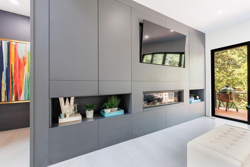 4036 Statewood Road Northeast Atlanta, GA 30342 - Photo 23 of 84 a living room with furniture and a fireplace