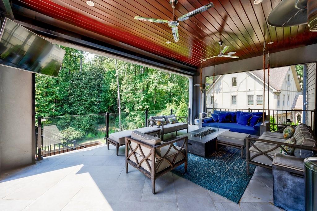 4036 Statewood Road Northeast Atlanta, GA 30342 - Photo 31 of 84 a living room with patio furniture and a floor to ceiling window