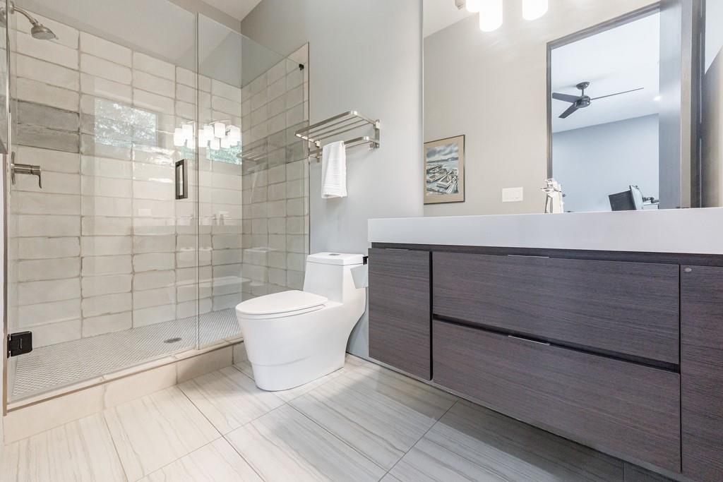 4036 Statewood Road Northeast Atlanta, GA 30342 - Photo 33 of 84 a bathroom with a sink a toilet and shower