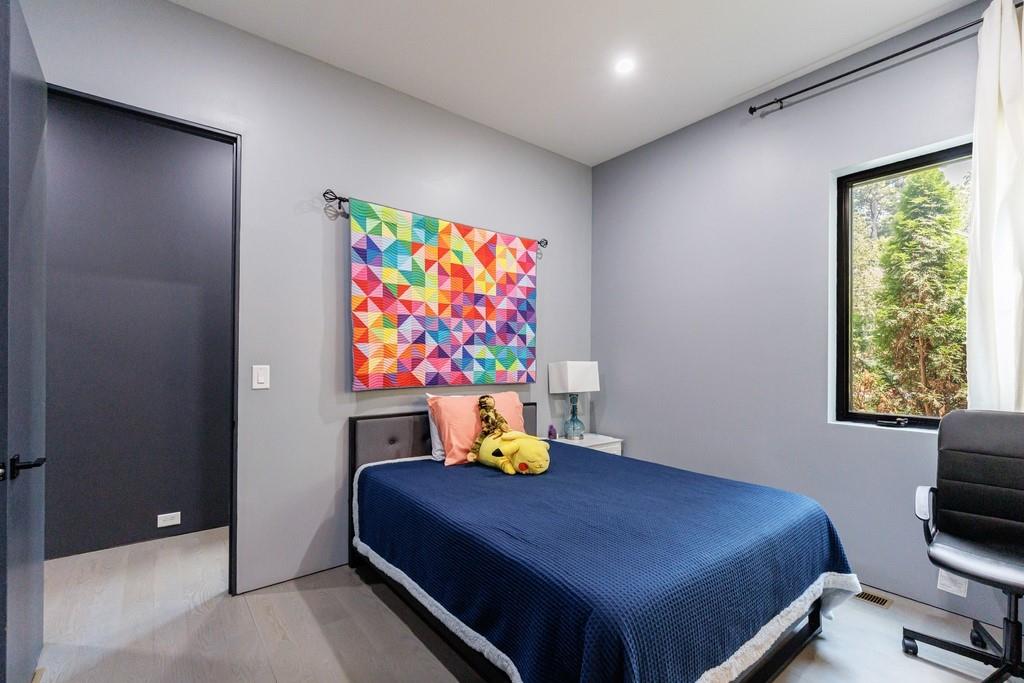 4036 Statewood Road Northeast Atlanta, GA 30342 - Photo 35 of 84 a bedroom with a bed and furniture