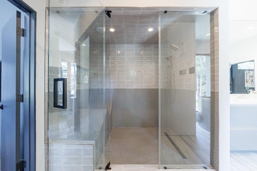 4036 Statewood Road Northeast Atlanta, GA 30342 - Photo 44 of 84 a bathroom with a glass shower door