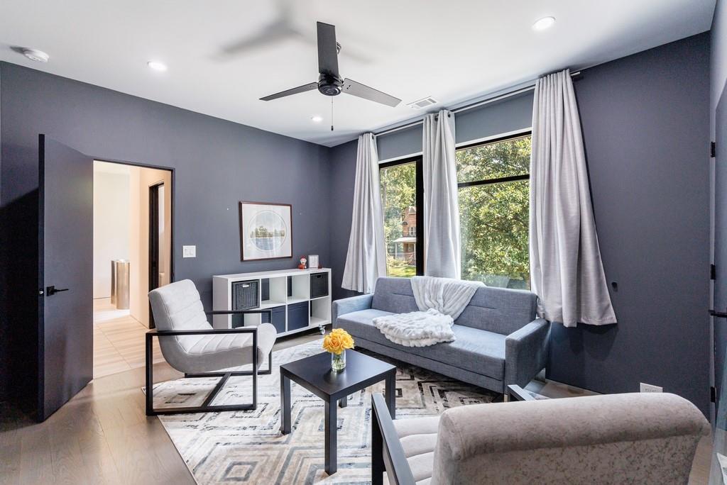 4036 Statewood Road Northeast Atlanta, GA 30342 - Photo 47 of 84 a living room with furniture and a large window