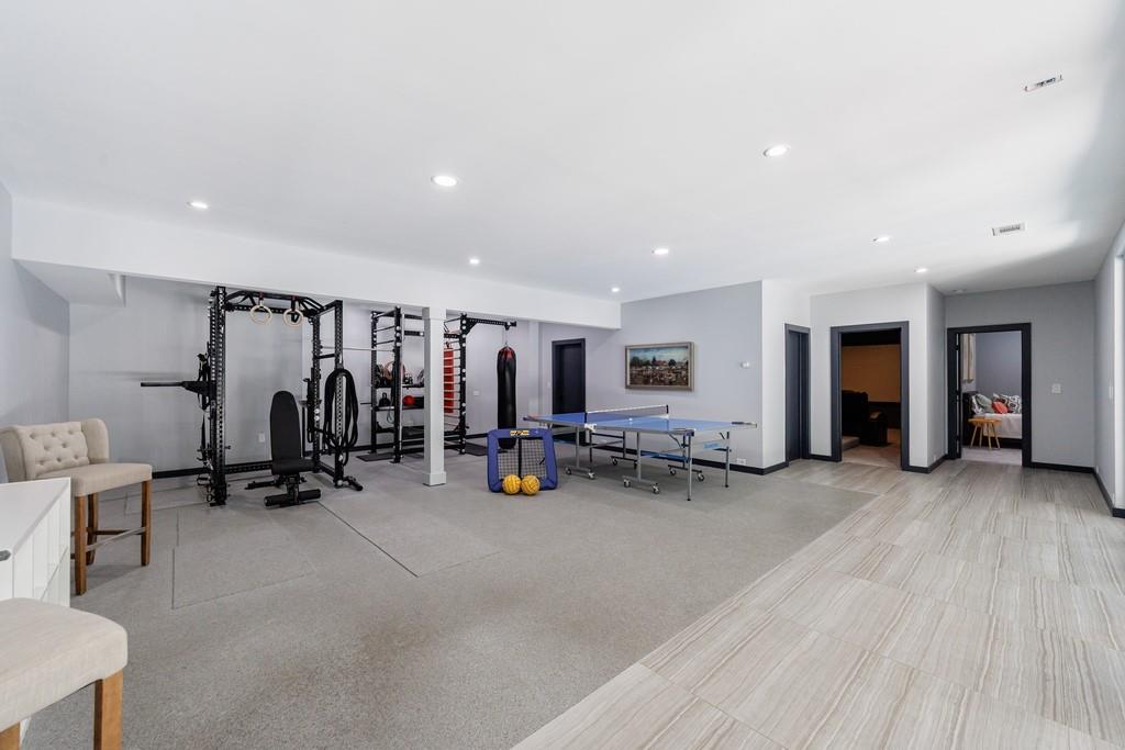 4036 Statewood Road Northeast Atlanta, GA 30342 - Photo 57 of 84 a view of a room with gym equipment and a large window