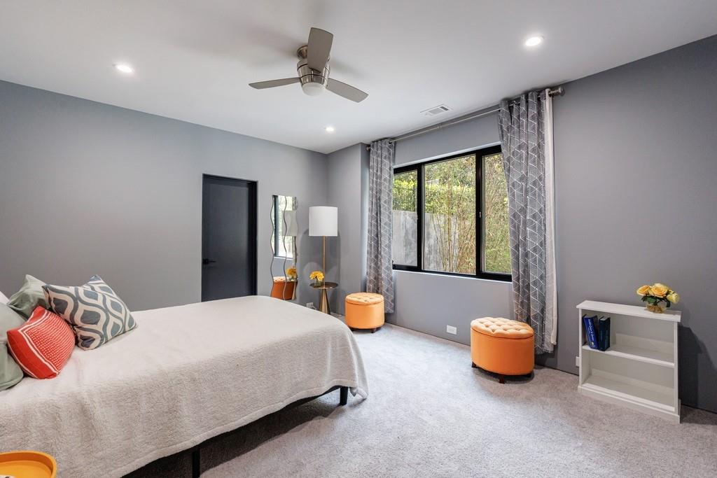 4036 Statewood Road Northeast Atlanta, GA 30342 - Photo 62 of 84 a bedroom with furniture and a large window