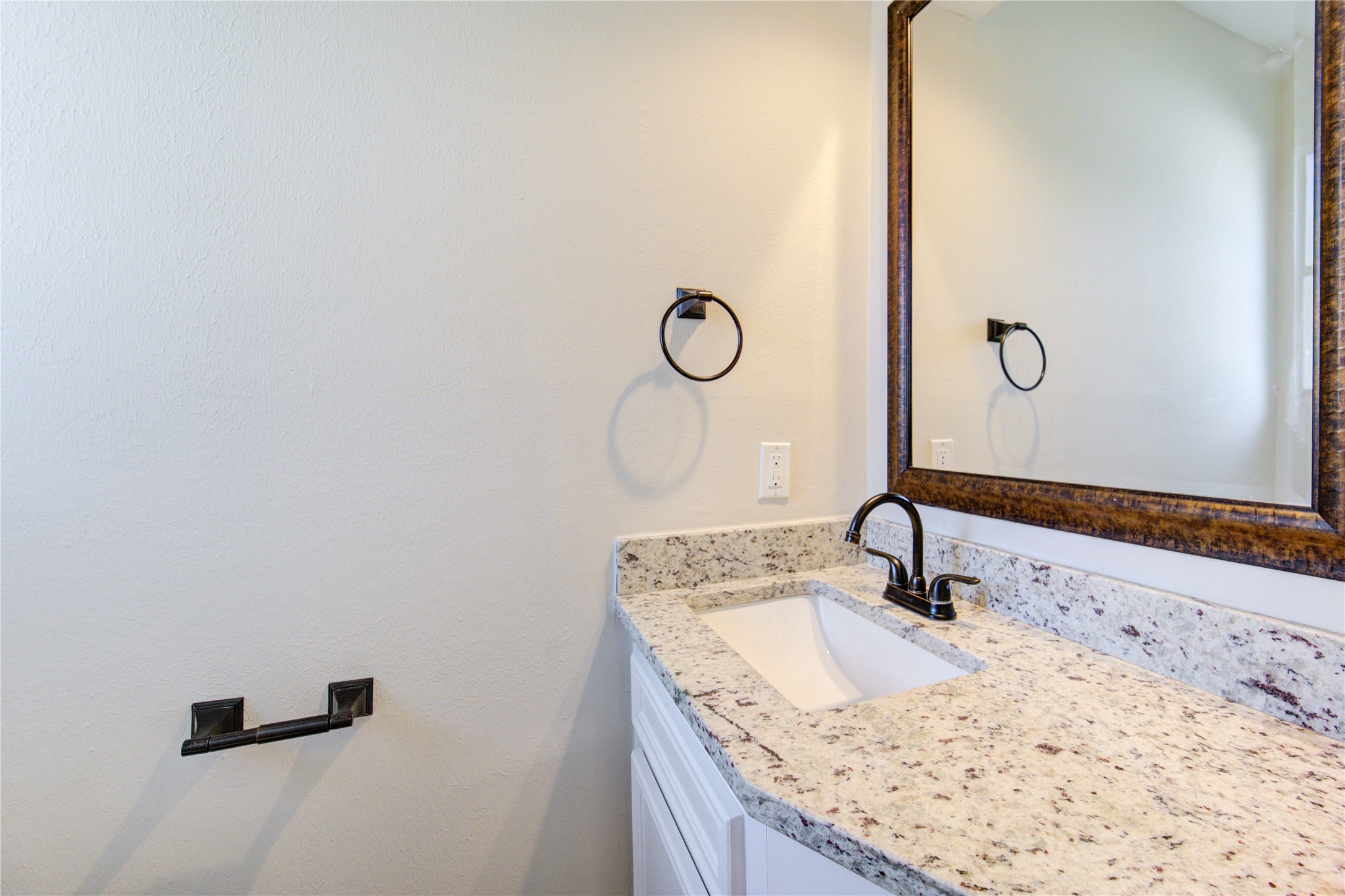 9115 Taidswood Drive Spring, TX 77379 - Photo 12 of 45 The downstairs half bath has a modern rectangle sink, granite counter and a bronze faucet and hardware. There is another half-bath, located near the game room, and it has a granite counters, a modern rectangle sink, with bronze hardware, recessed LED lighting and mirror. This lovely home has 2-half baths (one down and one up) and 2 full-sized baths.