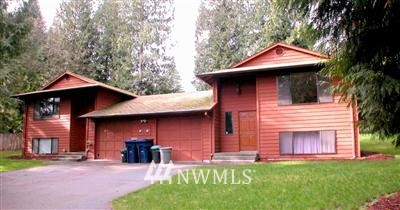 17210 3rd Avenue Southeast Bothell, WA 98012 - Photo 1 of 1 a front view of a house with a yard and trees