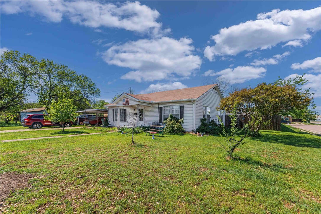 3840 Parrish Street Waco, TX 76705 - Photo 1 of 17 a view of a big house with a big yard and a large tree