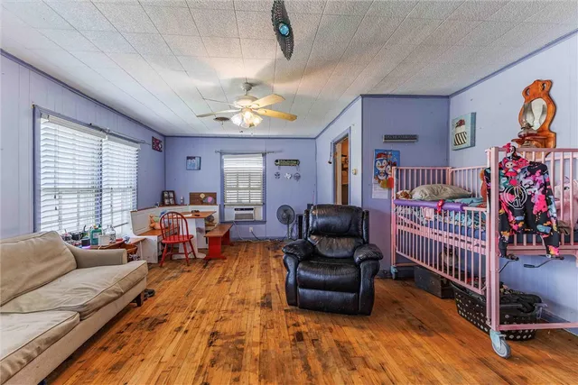 a bedroom with furniture and a window