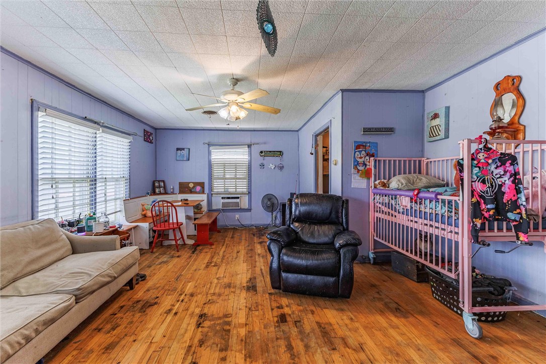 3840 Parrish Street Waco, TX 76705 - Photo 4 of 17 a bedroom with furniture and a window