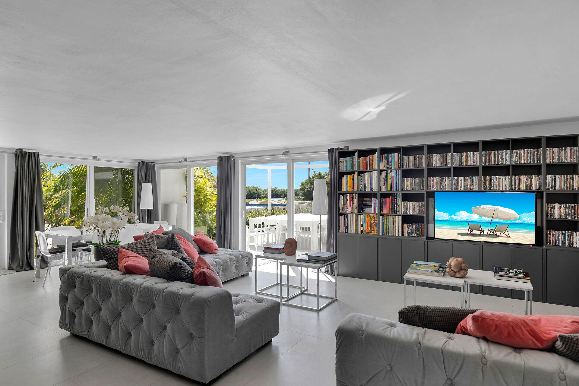 98701 Overseas Highway Key Largo, FL 33037 - Photo 11 of 47 a living room with furniture and a flat screen tv