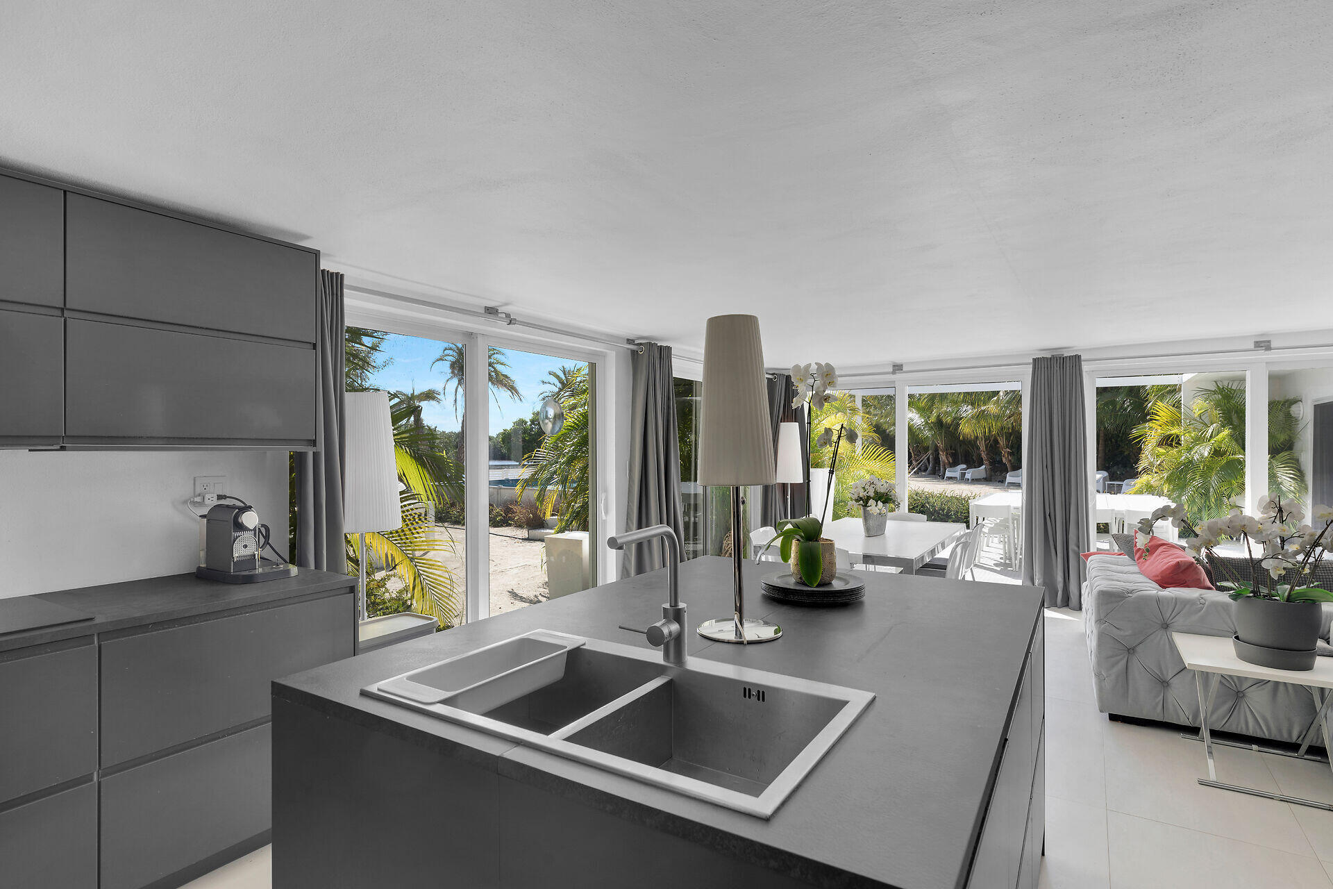 98701 Overseas Highway Key Largo, FL 33037 - Photo 15 of 47 a kitchen with a sink and living room