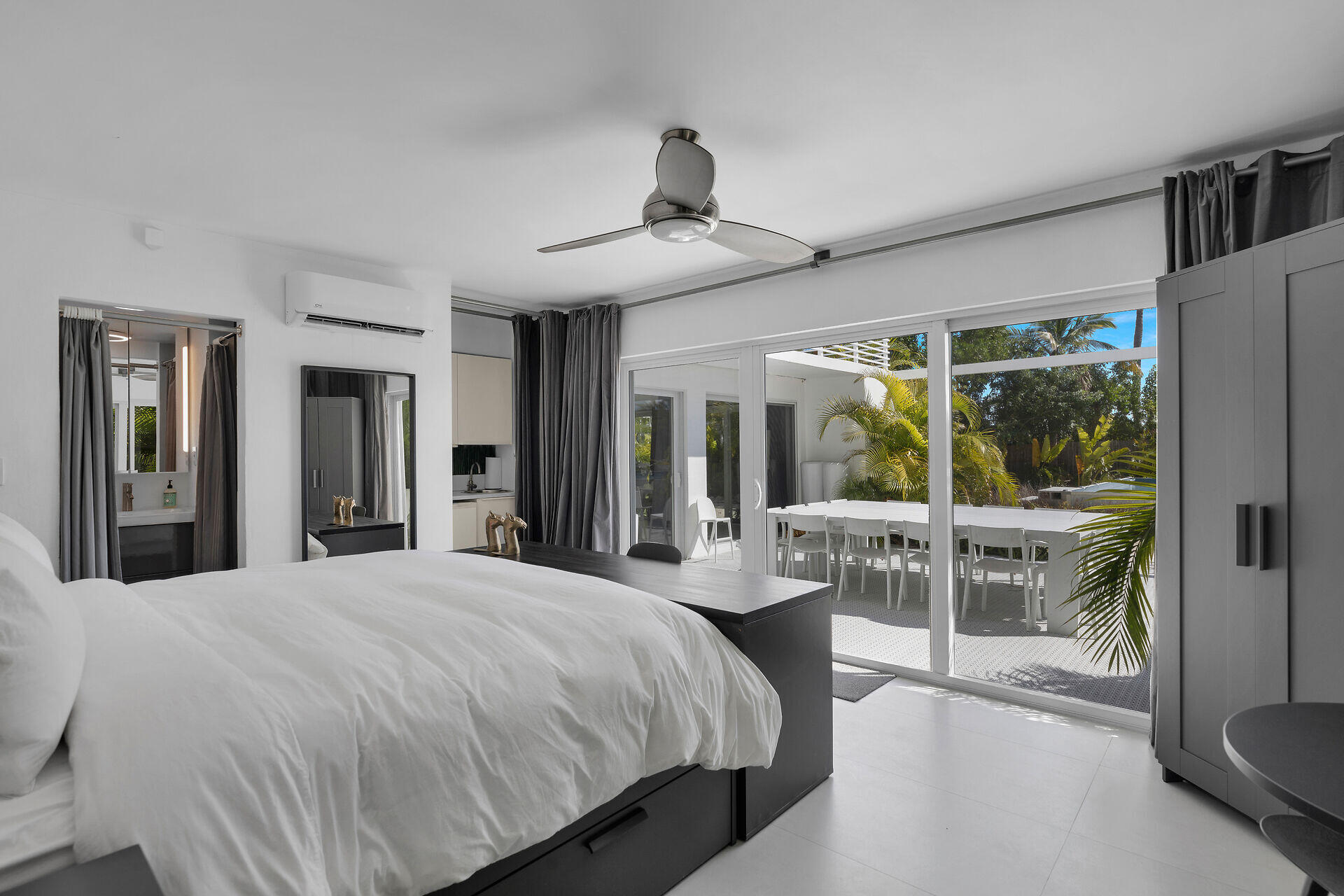 98701 Overseas Highway Key Largo, FL 33037 - Photo 17 of 47 a bedroom with a bed and a large window