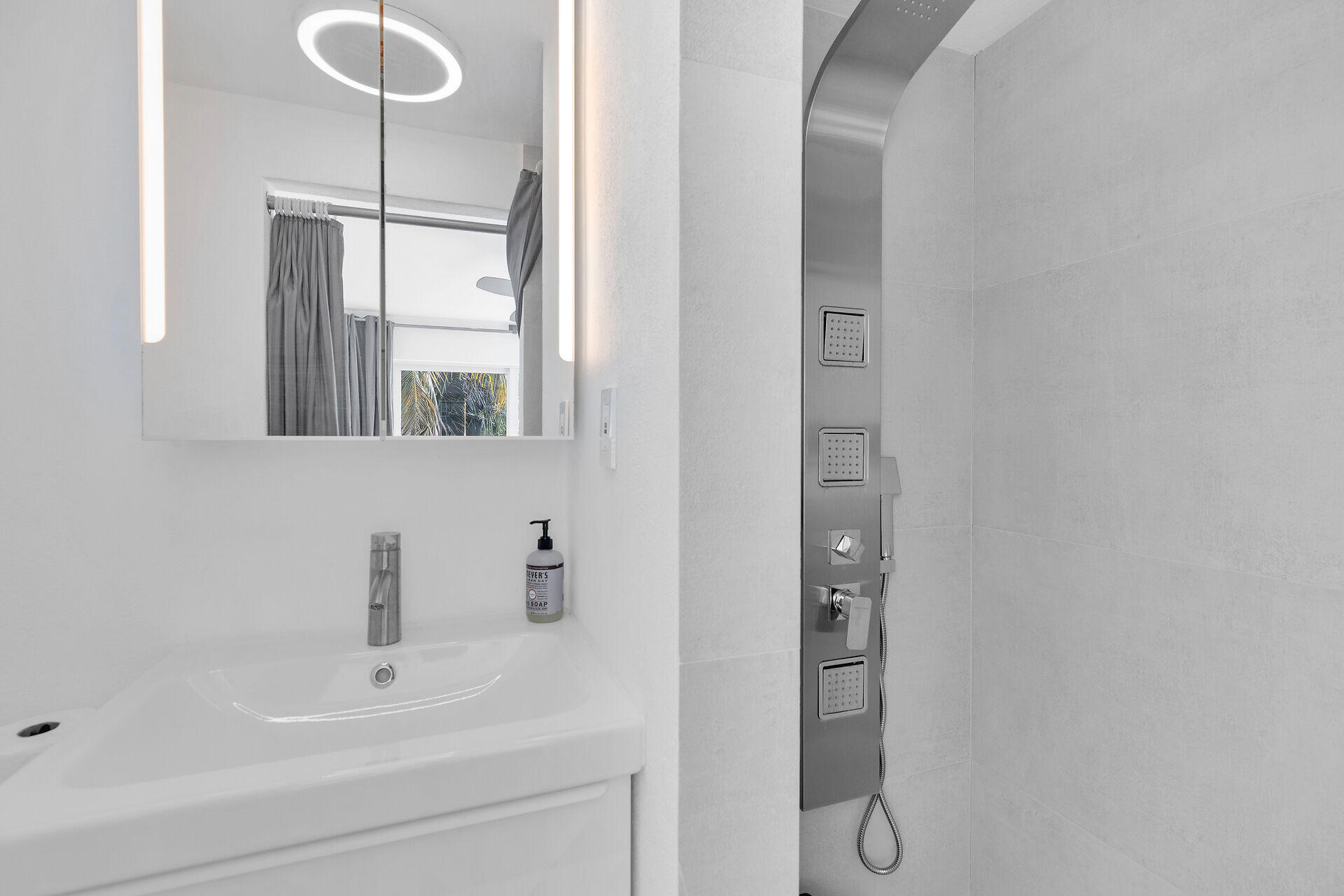 98701 Overseas Highway Key Largo, FL 33037 - Photo 26 of 47 a bathroom with a sink and a mirror