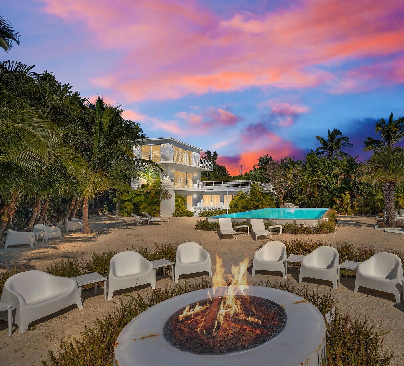 98701 Overseas Highway Key Largo, FL 33037 - Photo 3 of 47 a swimming pool with outdoor seating and outdoor kitchen