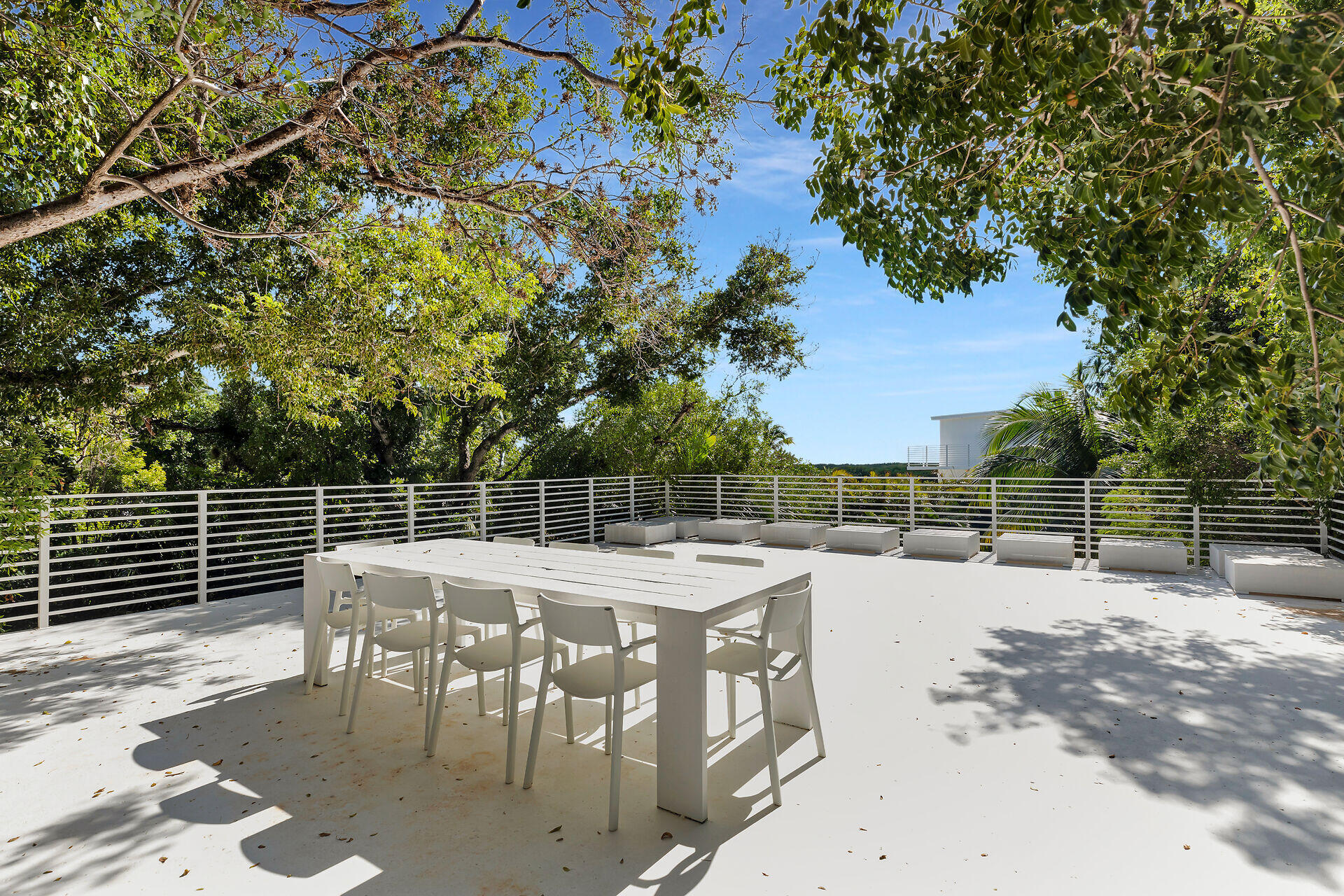 98701 Overseas Highway Key Largo, FL 33037 - Photo 45 of 47 a patio with table and chairs and potted plants