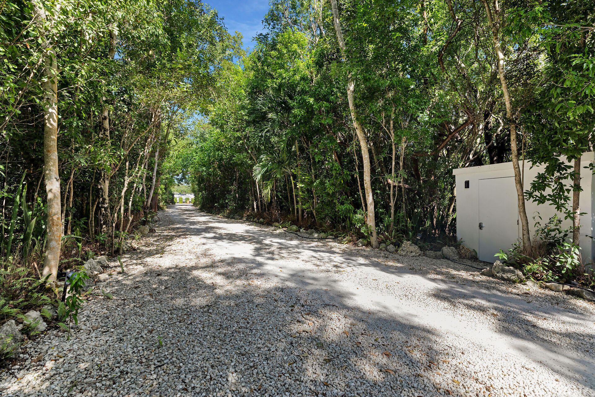 98701 Overseas Highway Key Largo, FL 33037 - Photo 46 of 47 a backyard of a house with lots of green space and fountain