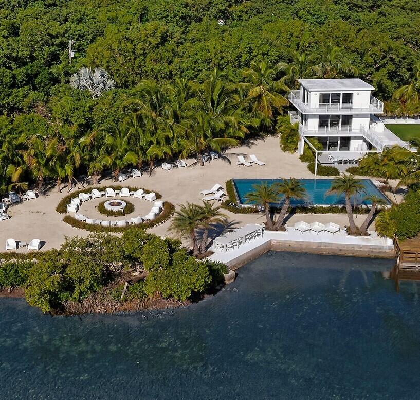 98701 Overseas Highway Key Largo, FL 33037 - Photo 47 of 47 a view of a house with a yard and sitting area