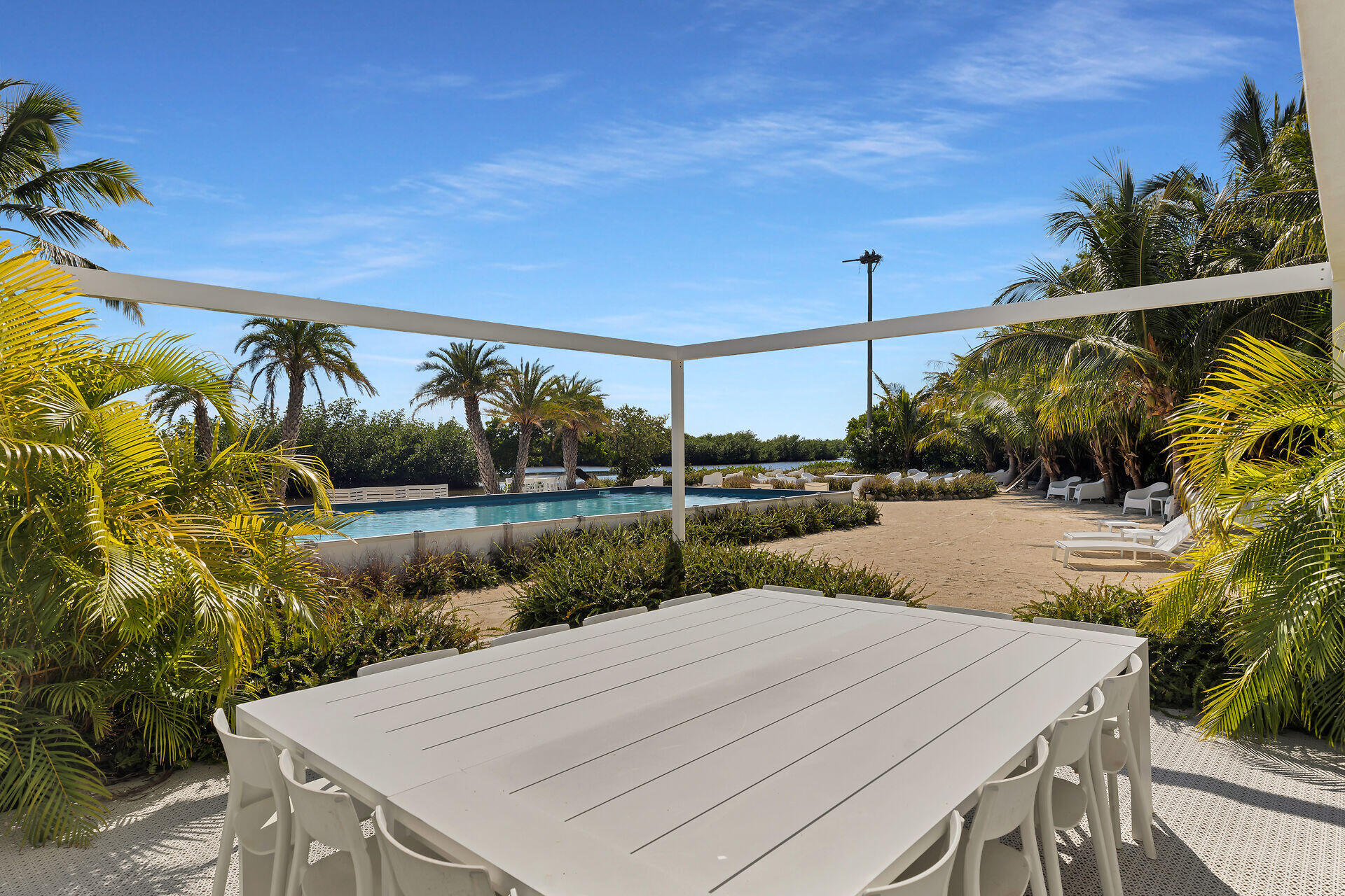 98701 Overseas Highway Key Largo, FL 33037 - Photo 7 of 47 a view of a swimming pool with a patio