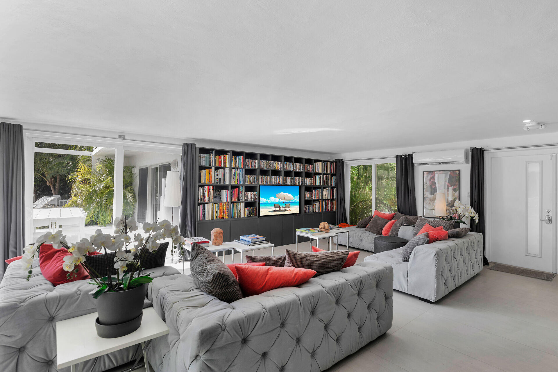 98701 Overseas Highway Key Largo, FL 33037 - Photo 10 of 47 a living room with furniture and a flat screen tv