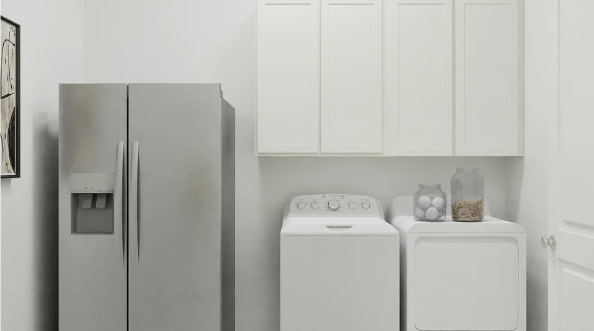 2707 Grove Crest Drive Rosenberg, TX 77469 - Photo 4 of 10 a view of storage and utility room with washer and dryer