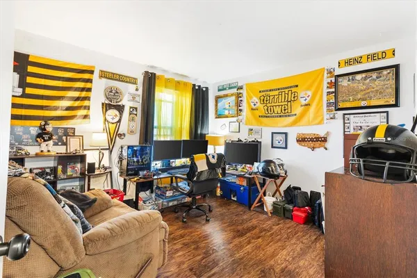 a view of a livingroom with workspace and a couch