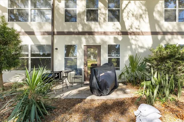 a view of outdoor space with dining table and chairs