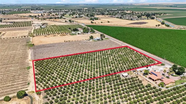 a view of a swimming pool with a yard