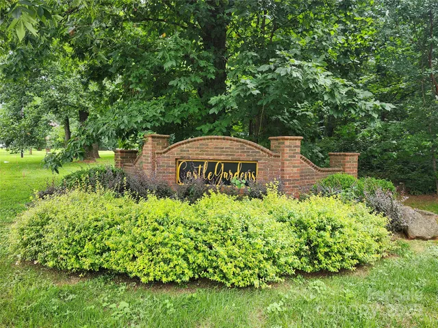 a view of a garden with a bench