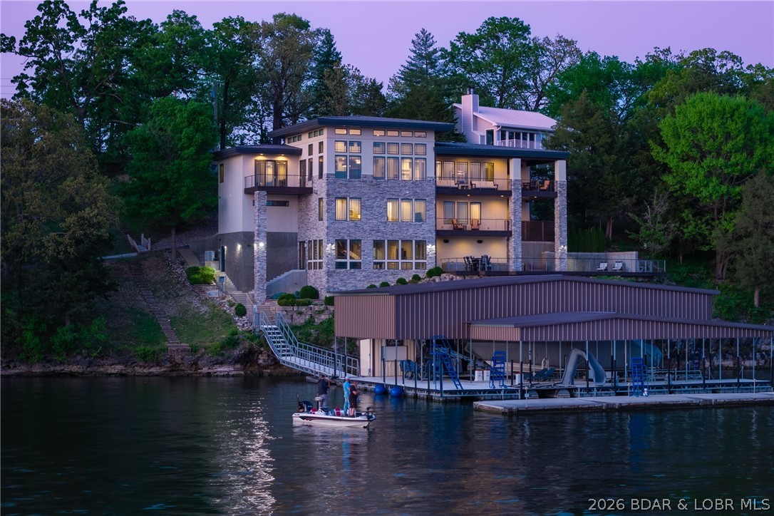 777 Malibu Road Osage Beach, MO 65065 - Photo 98 of 100 Peace settles in at dusk, a moment even the fisher