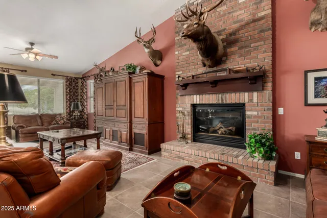 a view of a dining room with furniture large windows and wooden floor