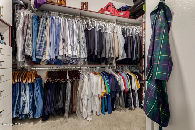 an empty room with fan and windows