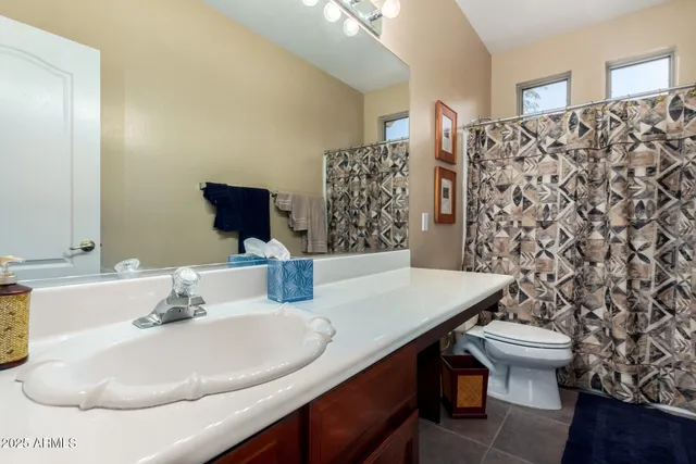 a view of a white house with a outdoor space