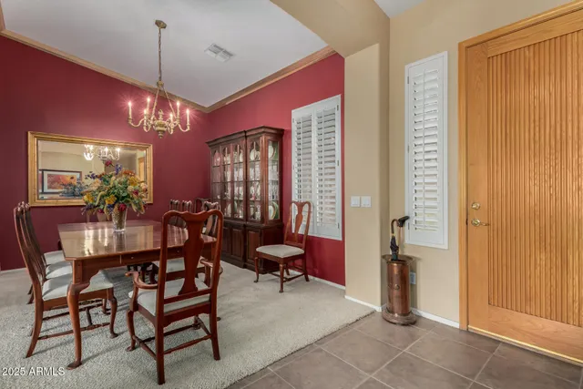 a view of a dining room with furniture and window