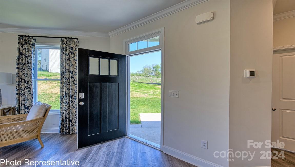 448 Wheatfield Road Fletcher, NC 28732 - Photo 2 of 47 a view of an entryway with wooden floor and windows