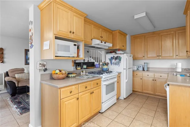 a kitchen with cabinets and appliances