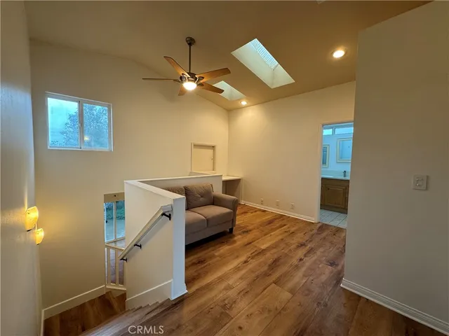 a living room with couches and painted walls