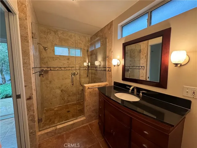 a bathroom with a sink a vanity and a mirror