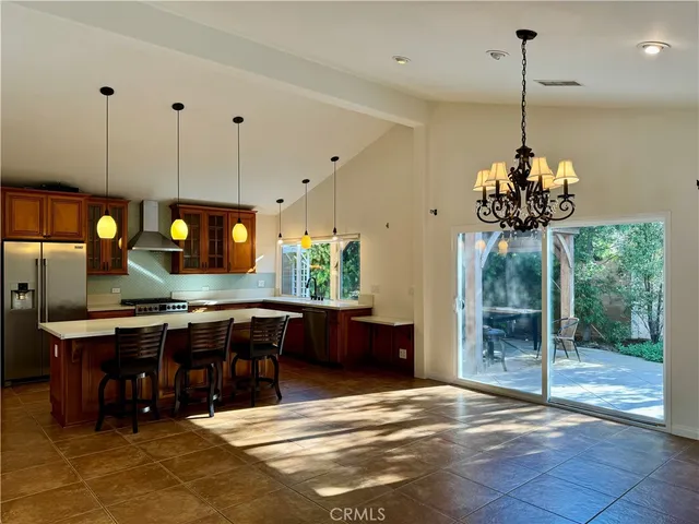 a view of a dining room with furniture window and chandelier