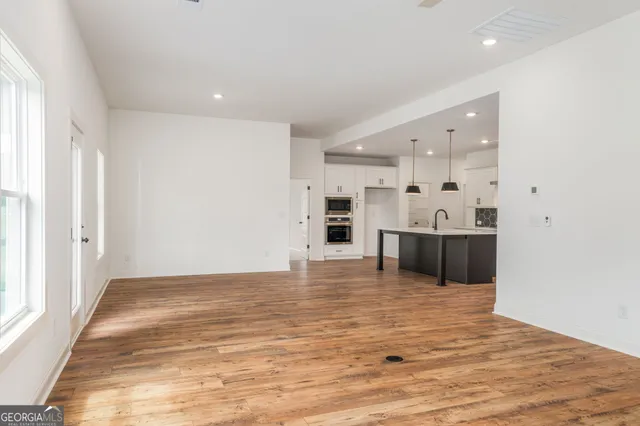 a bathroom with two mirror and a sink