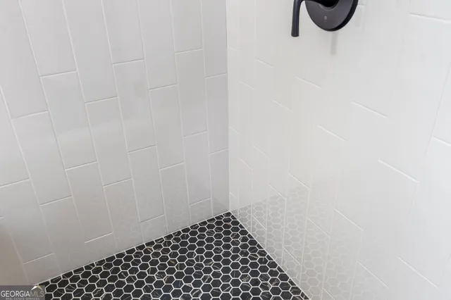 a bathroom with a sink and mirror