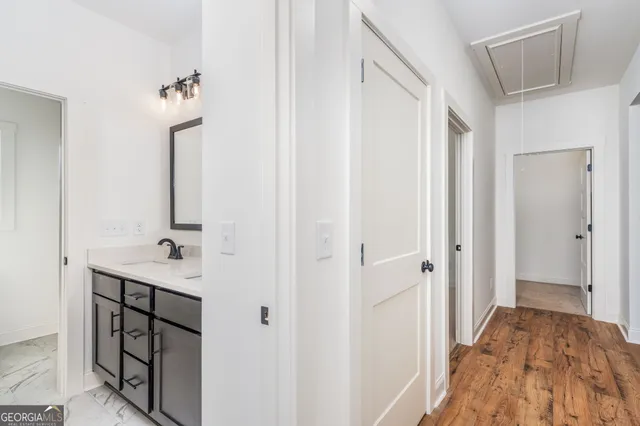 an aerial view of a residential houses with yard