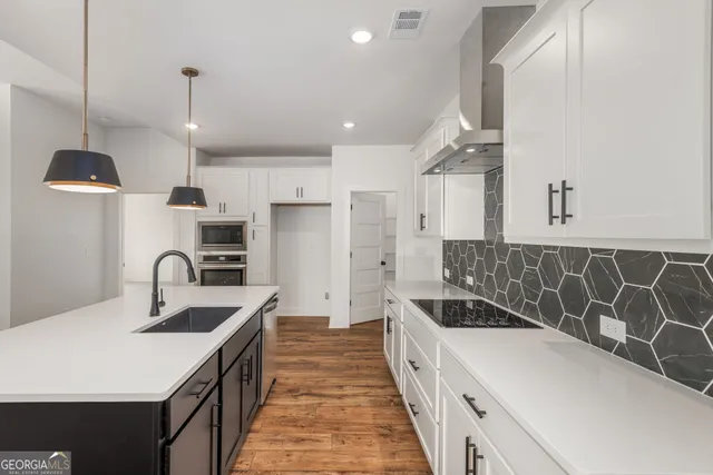 a kitchen with a sink and cabinets
