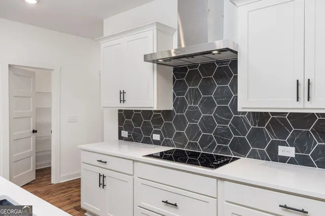 a kitchen with a sink and stove