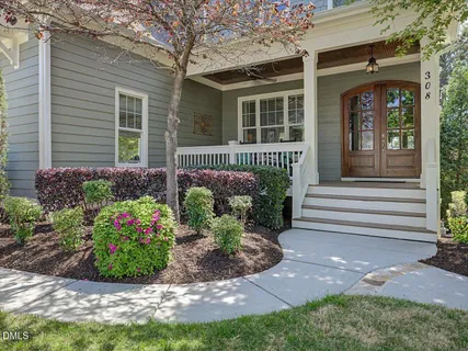 a living room with furniture and a ceiling fan