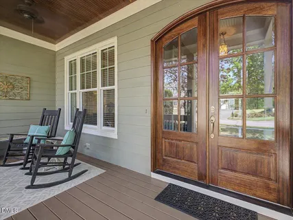 a kitchen with granite countertop a sink stove and refrigerator