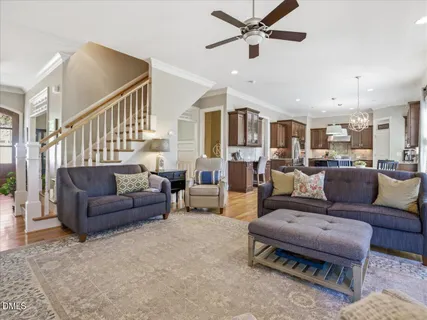 a balcony with furniture and a potted plant
