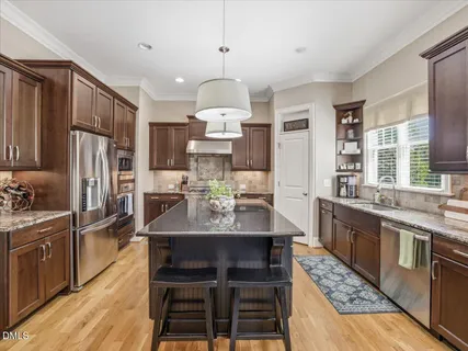 a view of entryway with wooden floor and front door