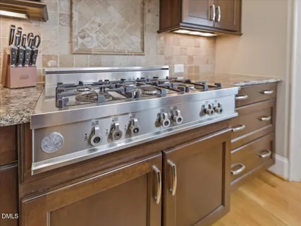 a bedroom with a bed and a couch next to a window