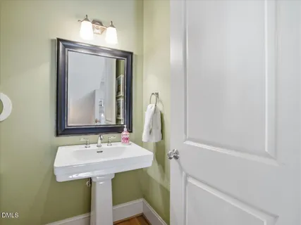 a bedroom with a bed lamp and window